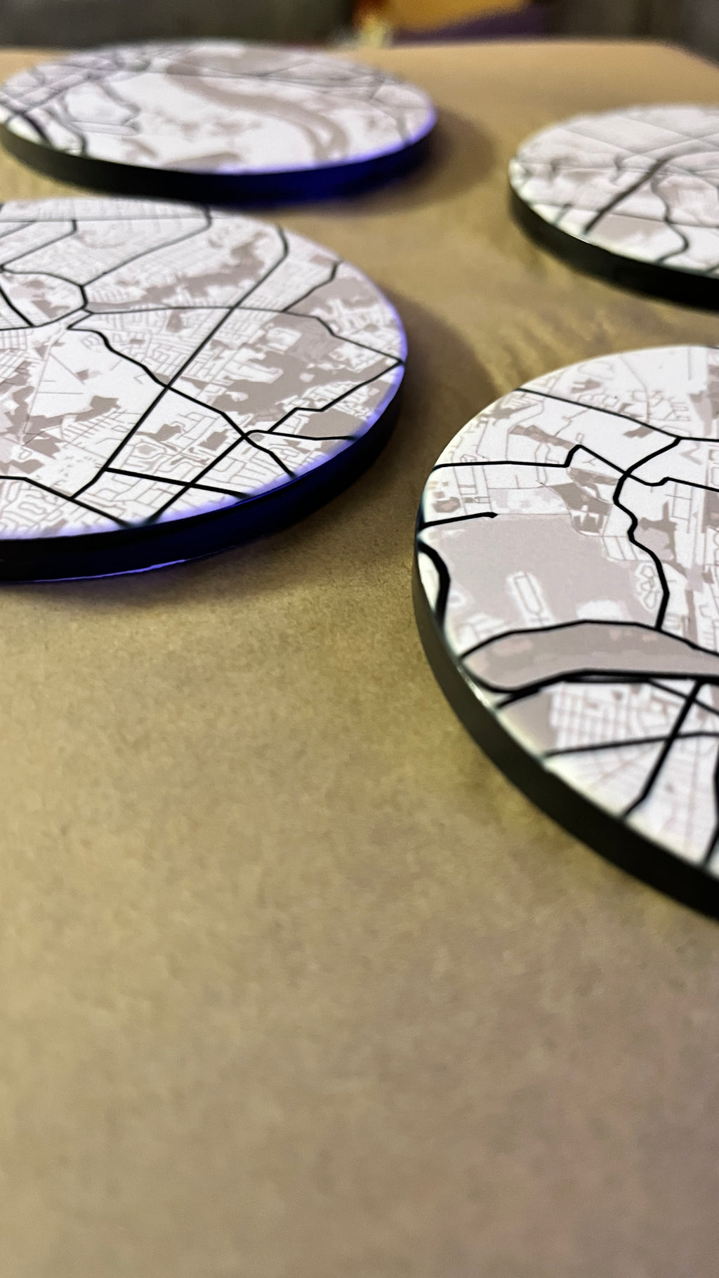 Personalized map coasters showing new home neighborhood