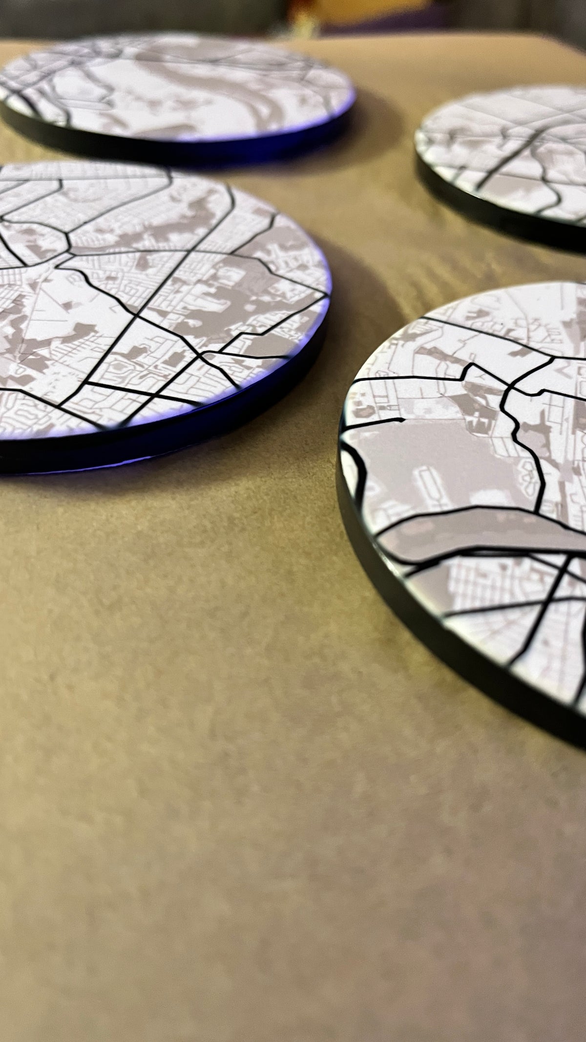Personalized map coasters showing new home neighborhood