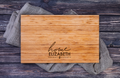 Engraved charcuterie board with home coordinates for new homeowner gift