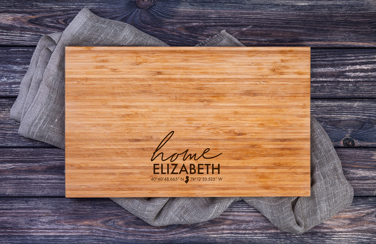 Engraved charcuterie board with home coordinates for new homeowner gift